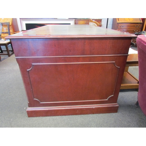 1111 - A Norfolk Manor twin pedestal mahogany desk, seven drawers, gilt tooled green leather insert, 77cm h... 