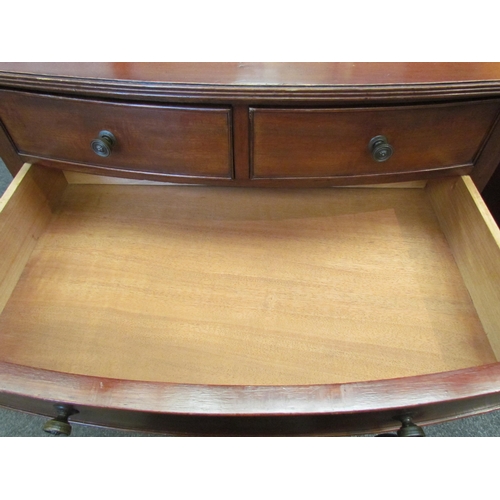 1114 - An Edwardian mahogany side table with two short over single long drawer, under-tier and on spade fee... 