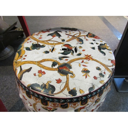 1132 - An Oriental style garden seat decorated with birds and foliage, 45cm tall