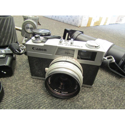 1186 - A box of vintage cameras and accessories including Canon camera, Olympus camera and cased lens