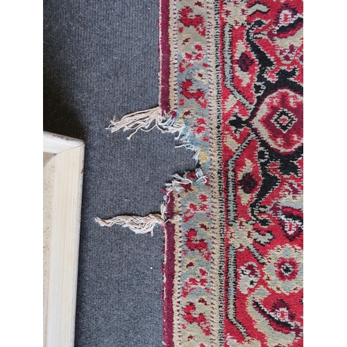 1156 - An Eastern wool hall runner rug, red and cream ground with foliate motifs, formerly from Holkham Hal... 