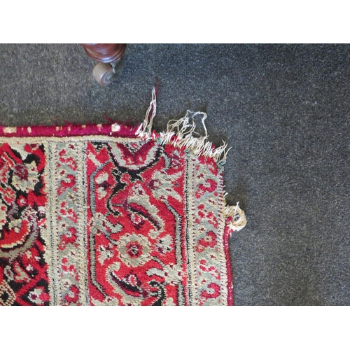 1156 - An Eastern wool hall runner rug, red and cream ground with foliate motifs, formerly from Holkham Hal... 