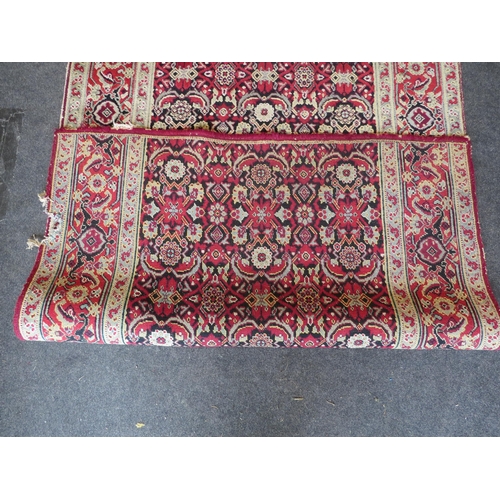 1156 - An Eastern wool hall runner rug, red and cream ground with foliate motifs, formerly from Holkham Hal... 