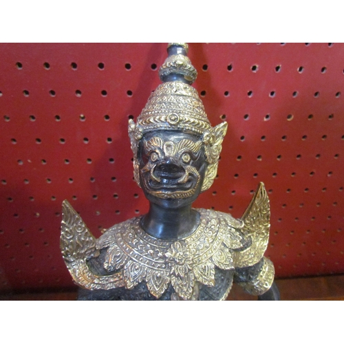 4059 - A Thai guardian deity figure (Teppanom), patinated bronze and brass, 12