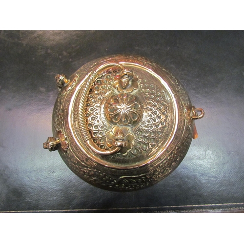 4070 - A 19th Century brass pandan / betel nut box, foliate design, 20cm diameter