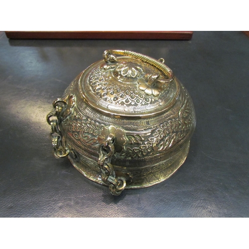 4070 - A 19th Century brass pandan / betel nut box, foliate design, 20cm diameter