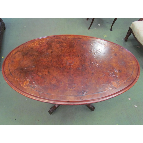 4118 - A mid Victorian inlaid burr walnut oval top lamp table over turned and carved supports, the outswept... 