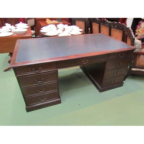 4123 - A George III revival mahogany twin pedestal partners desk the tooled leather insert over nine drawer... 