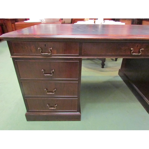 4123 - A George III revival mahogany twin pedestal partners desk the tooled leather insert over nine drawer... 