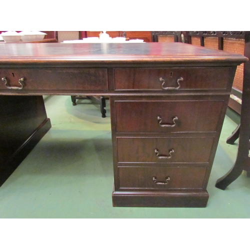 4123 - A George III revival mahogany twin pedestal partners desk the tooled leather insert over nine drawer... 