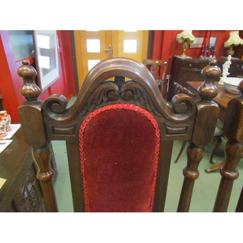 4146 - A pair of 17th Century style high back oak chairs with carved decoration, the turned finials on turn... 