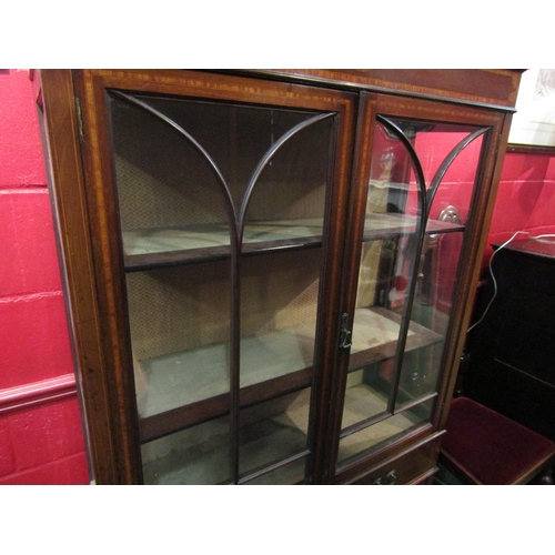 4152 - An Edwardian mahogany inlaid display cabinet with three shelves, glazed doors and sides, over two dr... 