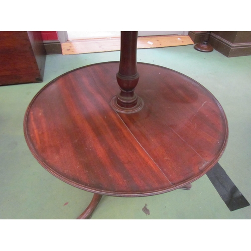 4159 - A George III mahogany three tier dumb waiter on tripod feet, 106cm high