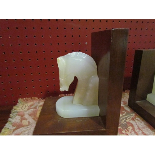 4205 - A pair of onyx horse head bookends