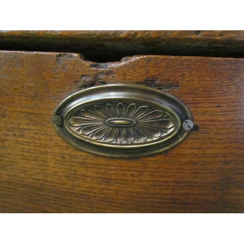 4216 - A 19th Century elm chest of small proportions, the hinged lid and paper lined interior over turned f... 