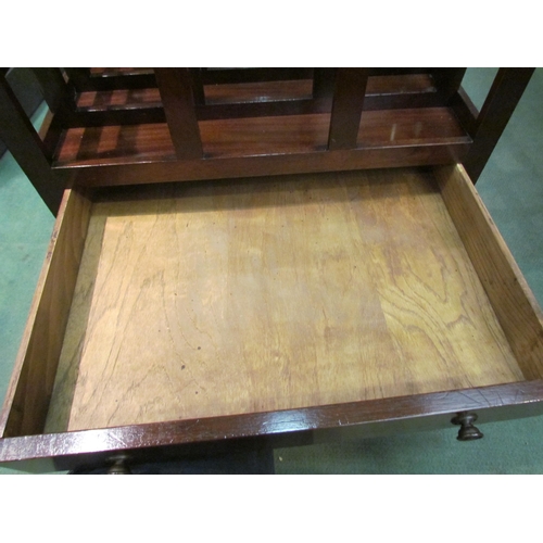 4234 - A Georgian mahogany four division Canterbury with fret handle over a single base drawer and brass cu... 