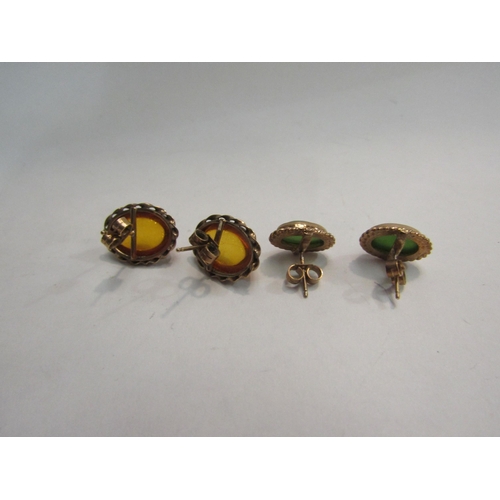 4369 - A pair of jade studs and a pair of amber studs, both pairs stamped 375 (2)