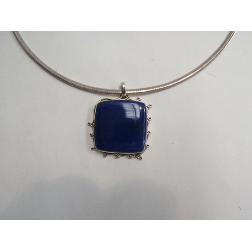 4378 - A heavy square form lapis lazuli pendant stamped 925 hung on chain stamped 925