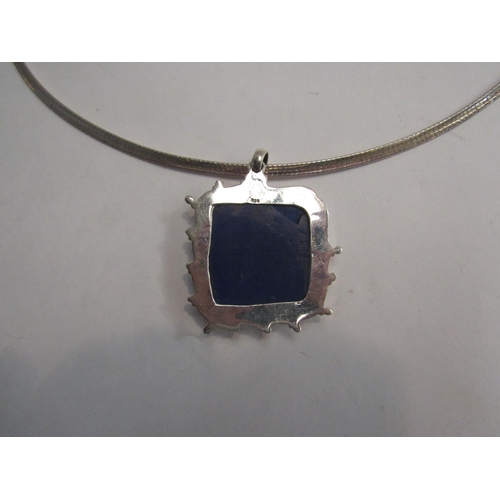 4378 - A heavy square form lapis lazuli pendant stamped 925 hung on chain stamped 925