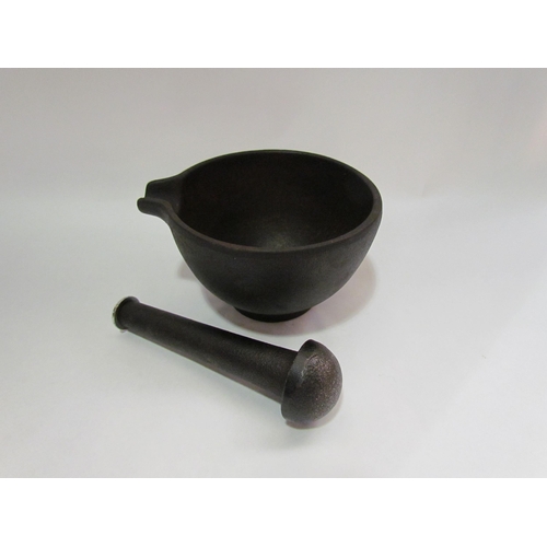 4304 - A cast mortar and pestle, 14.5cm diameter