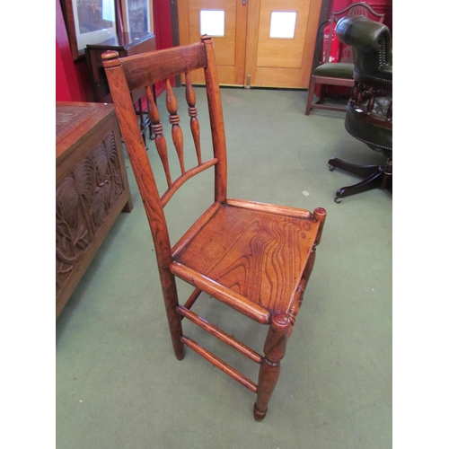 4073 - An 18th Century North West panel seat English elm chair with tri-ringed spindle back rest on turned ... 