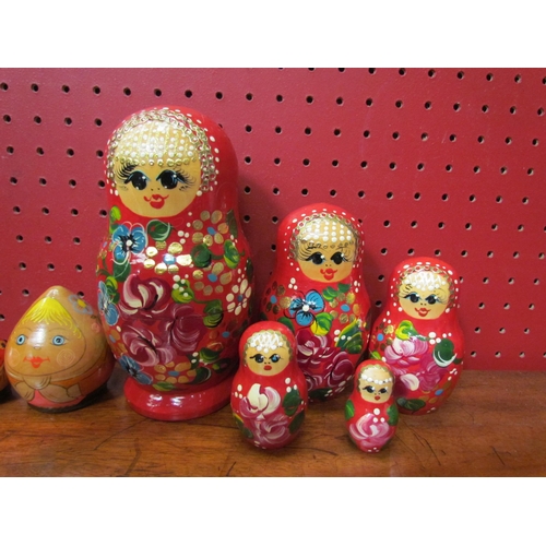 4084 - A set of five Russian dolls together with another set of two