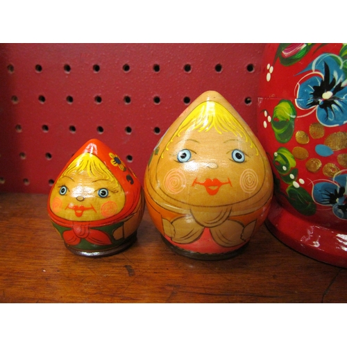 4084 - A set of five Russian dolls together with another set of two