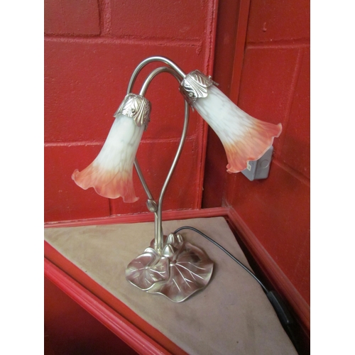 4157 - A lily-pad table lamp with a pair of pink tinged glass shades