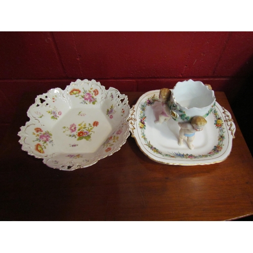 4162 - A Davenport hand-painted dish depicting flowers enriched with gilt, a hard paste porcelain dish and ... 