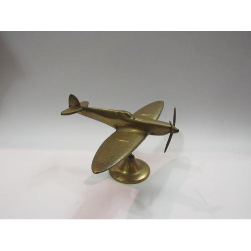 4307 - A brass desk top model of a Spitfire, on stand, 11cm tall, 19cm long