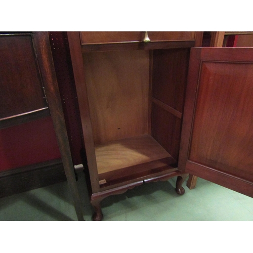 4067 - An Edwardian flame mahogany cabinet the single drawer and cupboard door over cabriole foot supports,... 