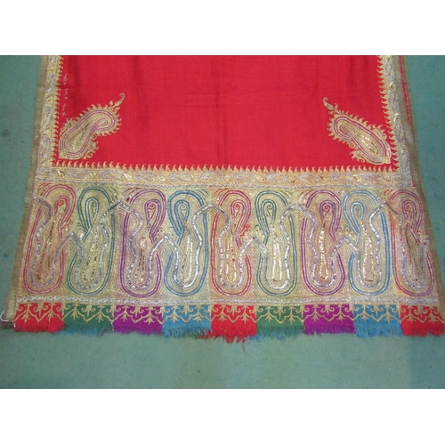 4180 - A late 19th Century Indian gold thread embroidered red felt shawl (worn)