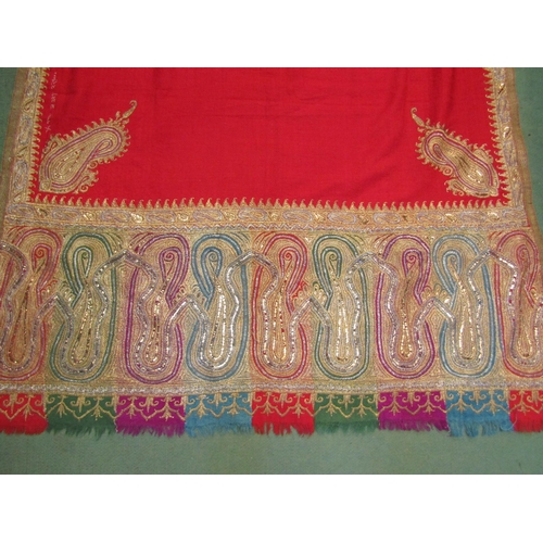 4180 - A late 19th Century Indian gold thread embroidered red felt shawl (worn)