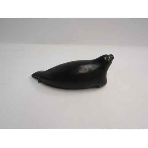 4337 - DAVID LEE (XX) A carved and polished stone figure of a seal, signed to base and marked 'E-9,734' to ... 