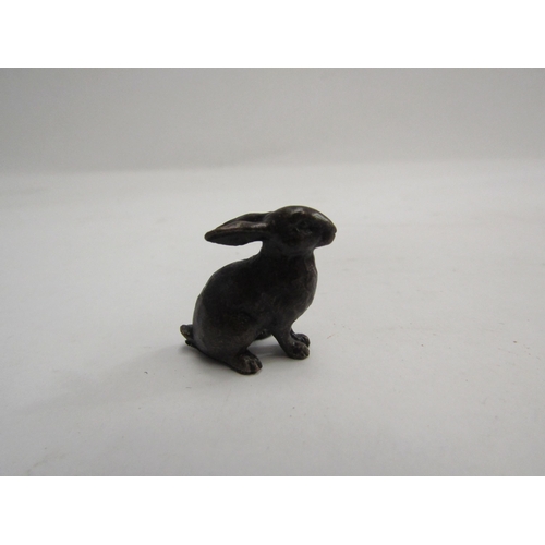 4344 - A miniature solid bronze bunny boxed with bag. 2.3cm tall