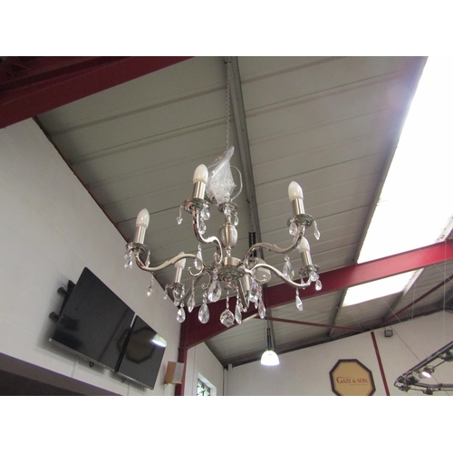 4470 - A modern silvered chandelier with six arms and droplets   (E) £15-20