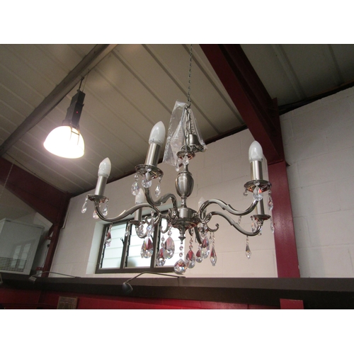 4470 - A modern silvered chandelier with six arms and droplets   (E) £15-20