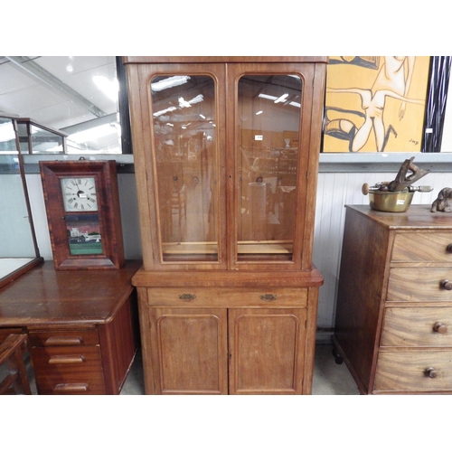 2128 - A Victorian mahogany and glazed bookcase on cupboard