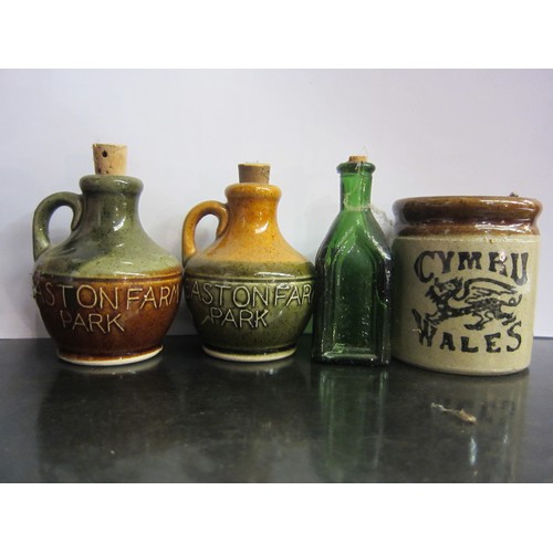 4314 - A box containing assorted stoneware items including bottles lidded caserole dish etc