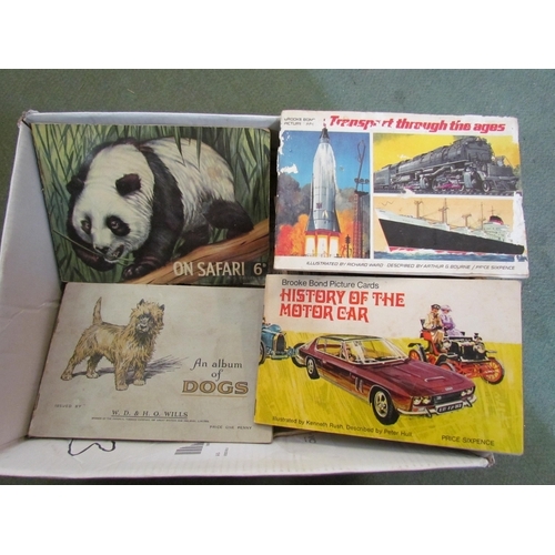 4247 - A box of ephemera to include cigarette cards, saucy postcards and particulars, plans and Condition o... 