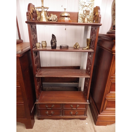 2133 - A mahogany wall shelf with fret cut sides and four small drawers