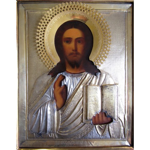 7130 - A 19th Century Russian Icon, oil on board with gilded and silvered metal relief moulding, gilded mou... 