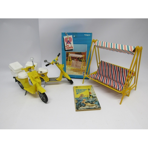 1180 - A boxed Pedigree Sindy garden swing together with two unboxed Sindy scooters and 'Lighthouse Mystery... 