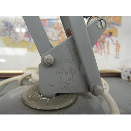 1218 - A Luxo metal anglepoise style lamp on heavy cast base, (a/f missing spring retainer)