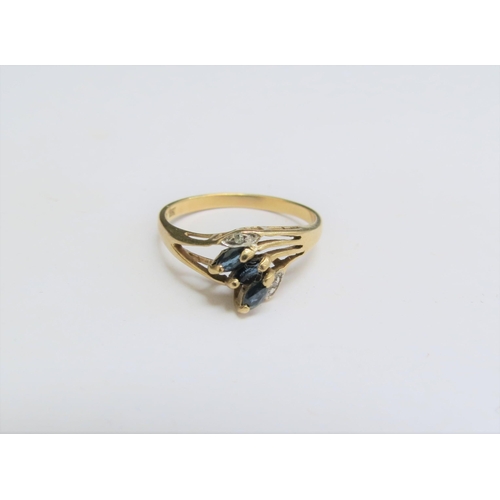 1302 - A 9ct gold sapphire and diamond chip dress ring. Size M, 1.2g