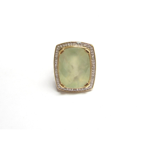 8068 - A 14ct gold prehnite and diamond ring, the central facet cut stone with diamond set basket weave sho... 