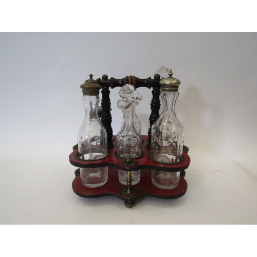 1183 - A Smalls & Hipkiss leather and wood cruet with matching bottles
