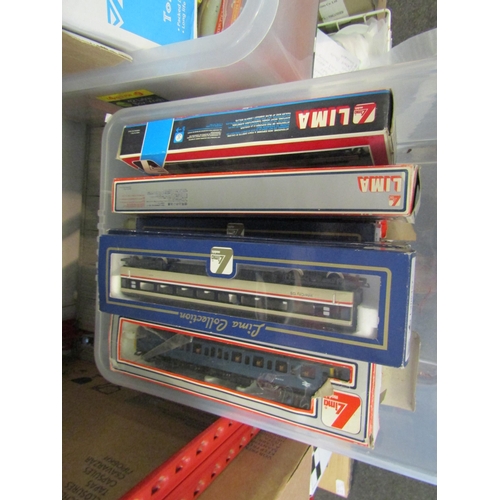 1210 - A collection of boxed and loose playworn '00' gauge model railway rolling stock, mostly Lima