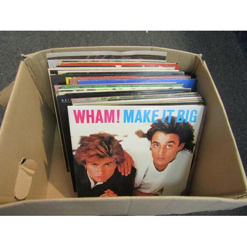 1225 - A collection of assorted vinyl LP's including Wham!, Abba, Rod Stewart, Hot Chocolate, the Muppets, ... 