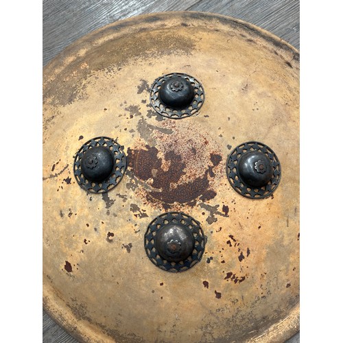 9014 - An Indian Dhal shield, circular form with four steel mounts, traces of leather covering present, tog... 